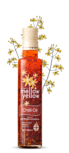 Farrington's Mellow Yellow Chilli Oil with rapeseed plant backdrop